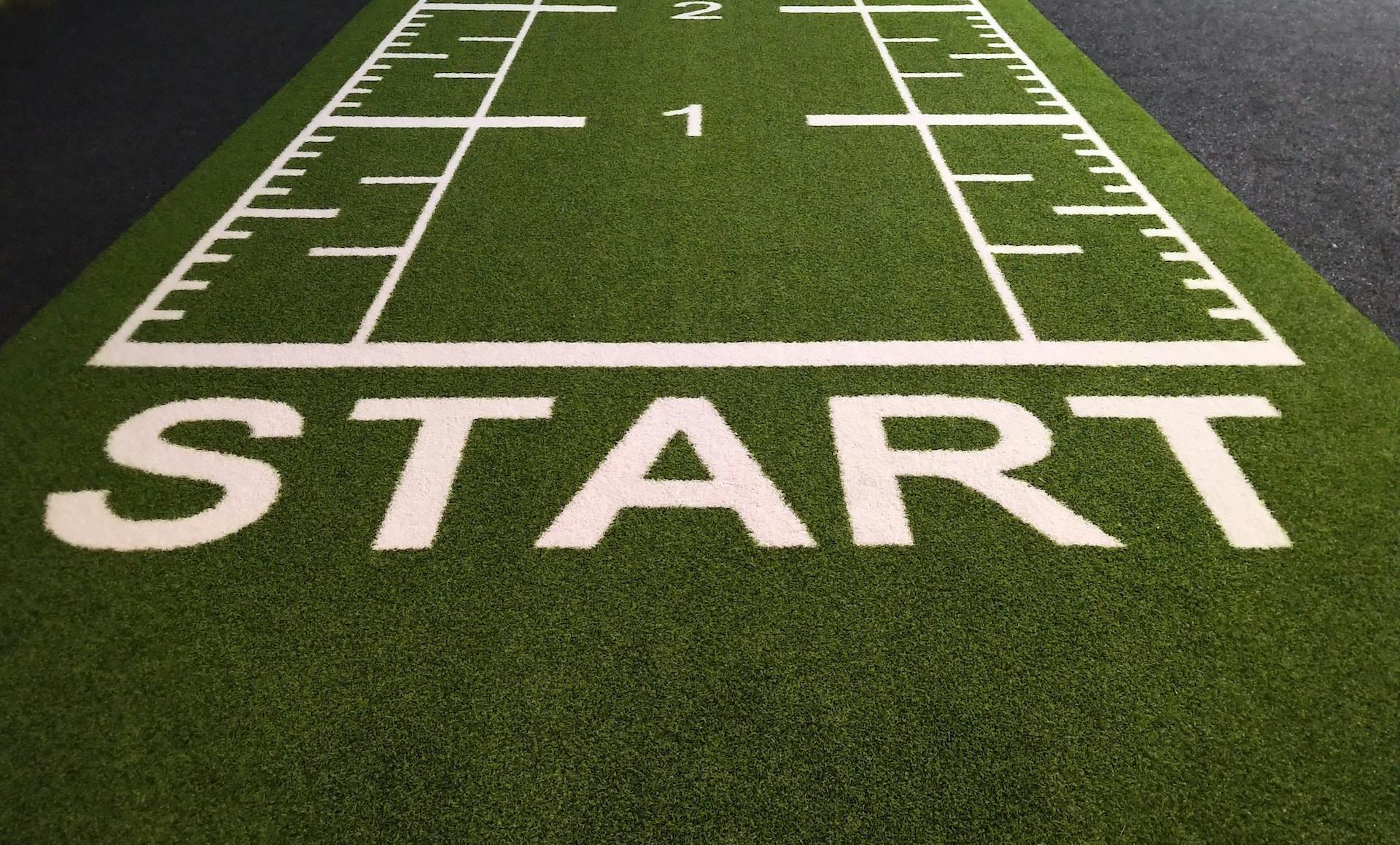 Image of a green rug with the test 'Start'